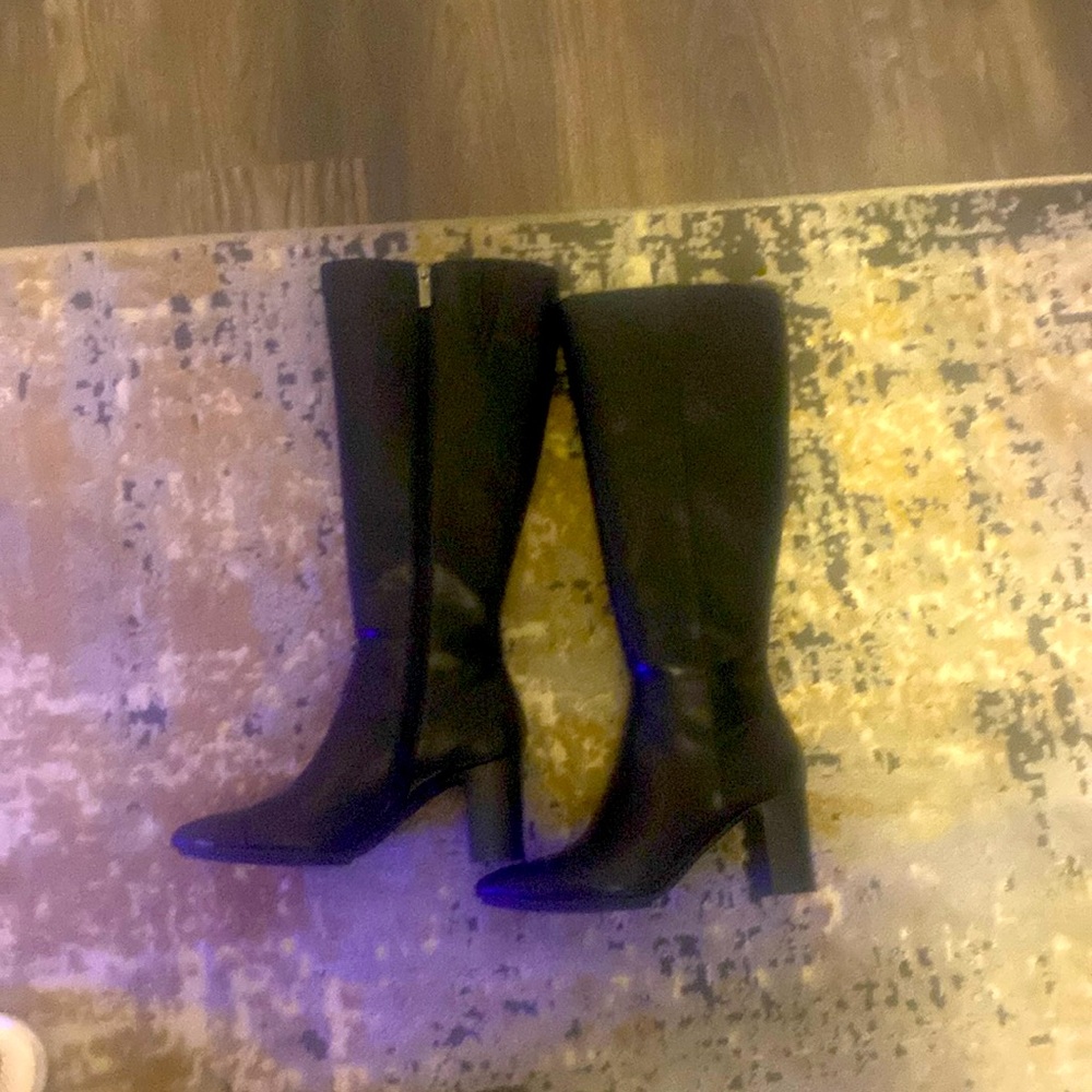 Brand new black boots.  Perfect amt of heel.     Very comfortable to walk in.
